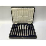 A cased set of silver handled knives and forks.