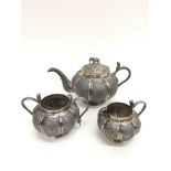 A three piece Indian silver teaset of lobed shape