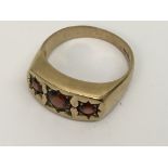 A gent's 9ct gold and garnet set signet ring.Appro