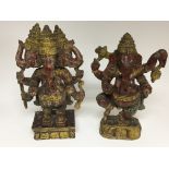 Two hand painted and carved wood figures of the go
