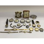 A collection of watches, pocket watches and travel