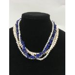 Two cultured pearl necklaces, one set with Lapis