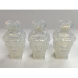 A trio of small Sabino glass perfume bottles, appr
