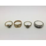 Four 9ct gold rings set with diamonds and other st
