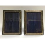 A pair of silver photograph frames, Sheffield hallmarks, approx 16cm x 21cm.