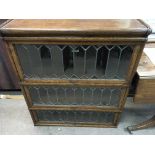 A Globe Wernicke type oak bookcase with three sections with up and over lead light doors.