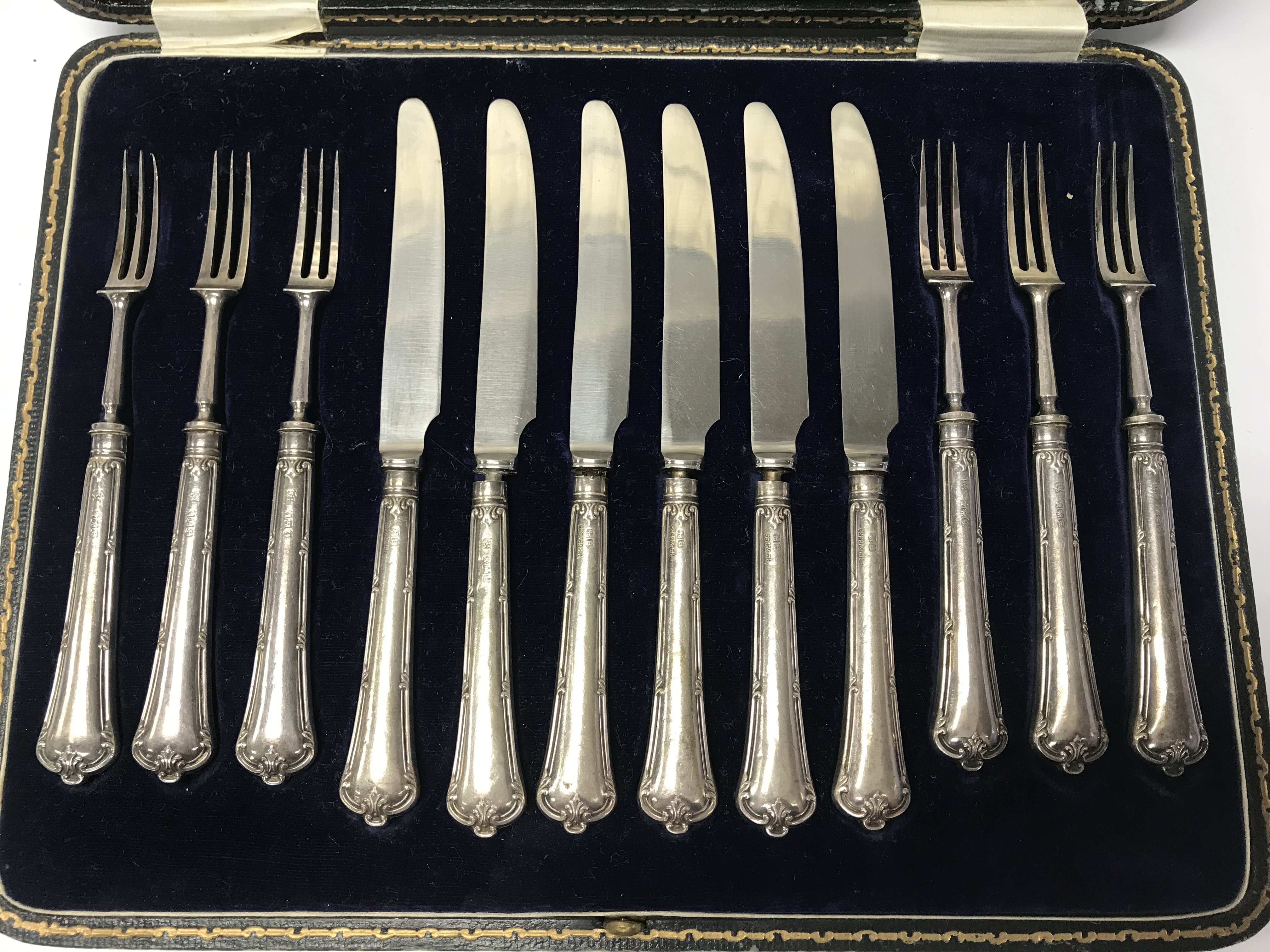 A cased set of silver handled knives and forks. - Image 2 of 2