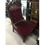 A Victorian upholstered button back nursing chair.