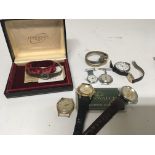 A Ladies Silver Longines Watch two coin watches a