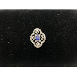 An Edwardian brooch set with a central sapphire, s