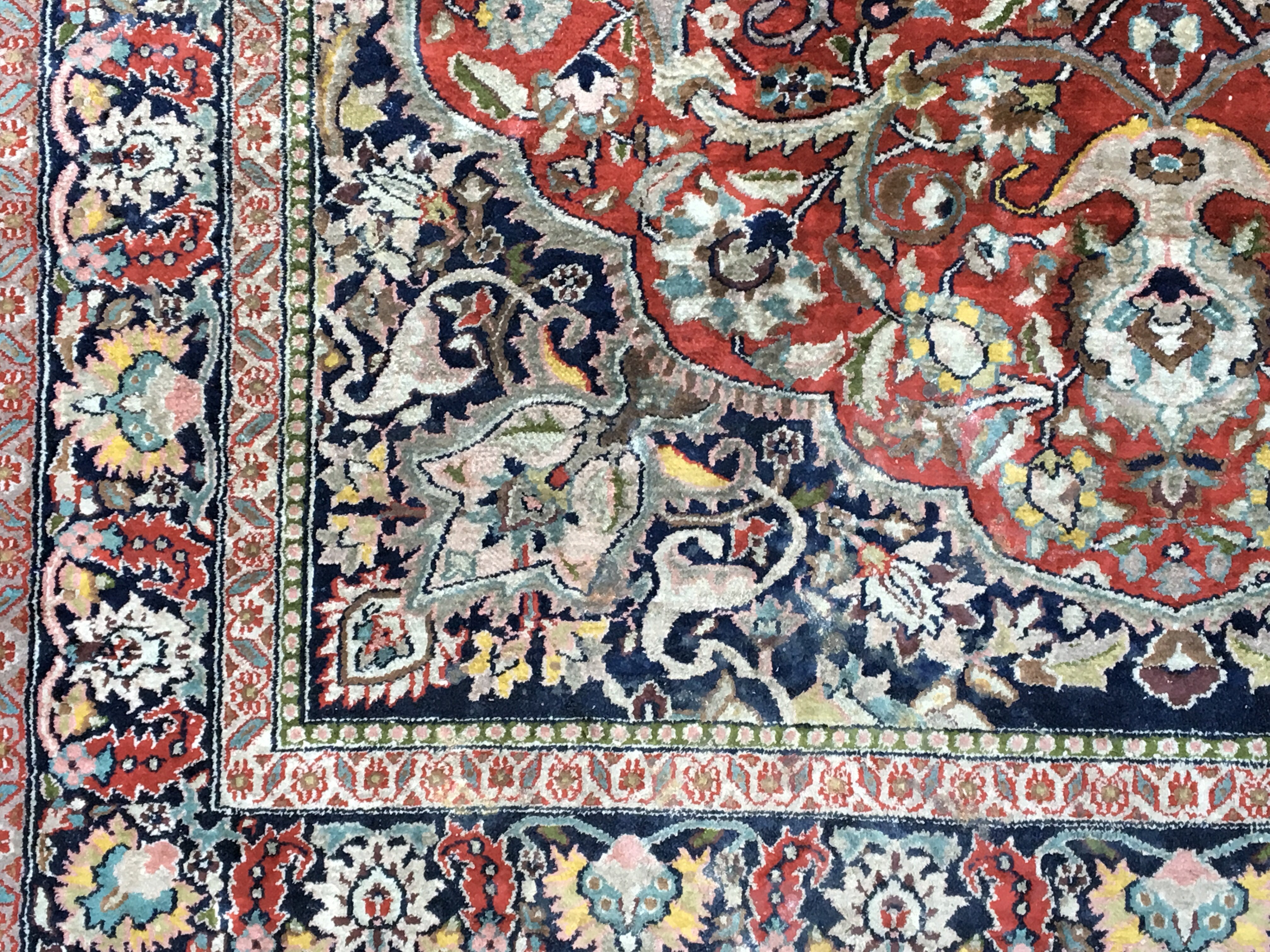 A Persian part silk hand knotted rug with a floral - Image 2 of 4