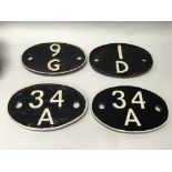 A group of train carriage plates including two cas
