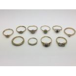Ten 9ct gold rings set with diamonds and other sto