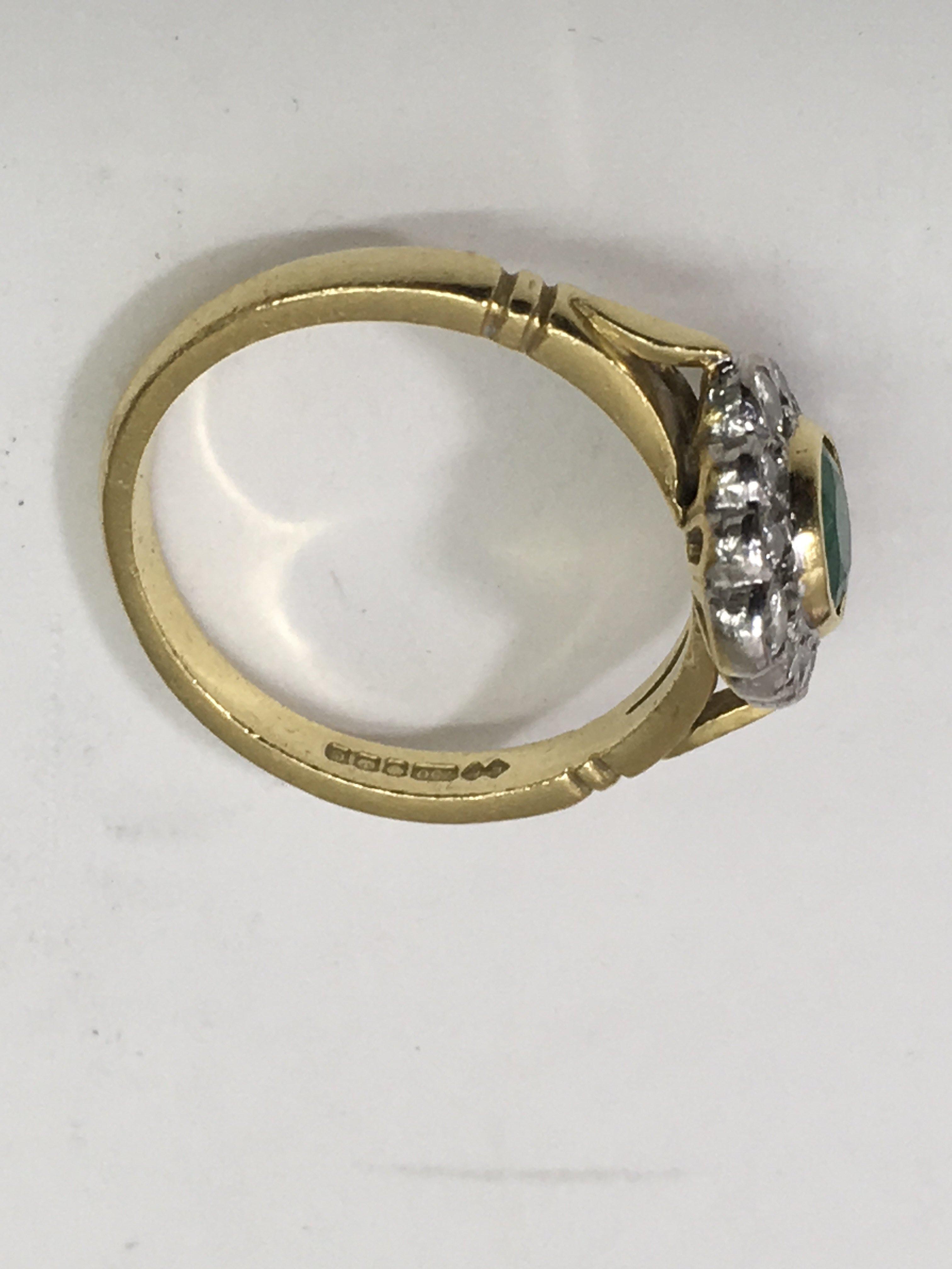 An 18ct gold ring set with central emerald in diam - Image 2 of 2