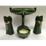 A four piece Art Nouveau ceramic set comprising a