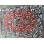 A Persian hand knotted rug with a central star med