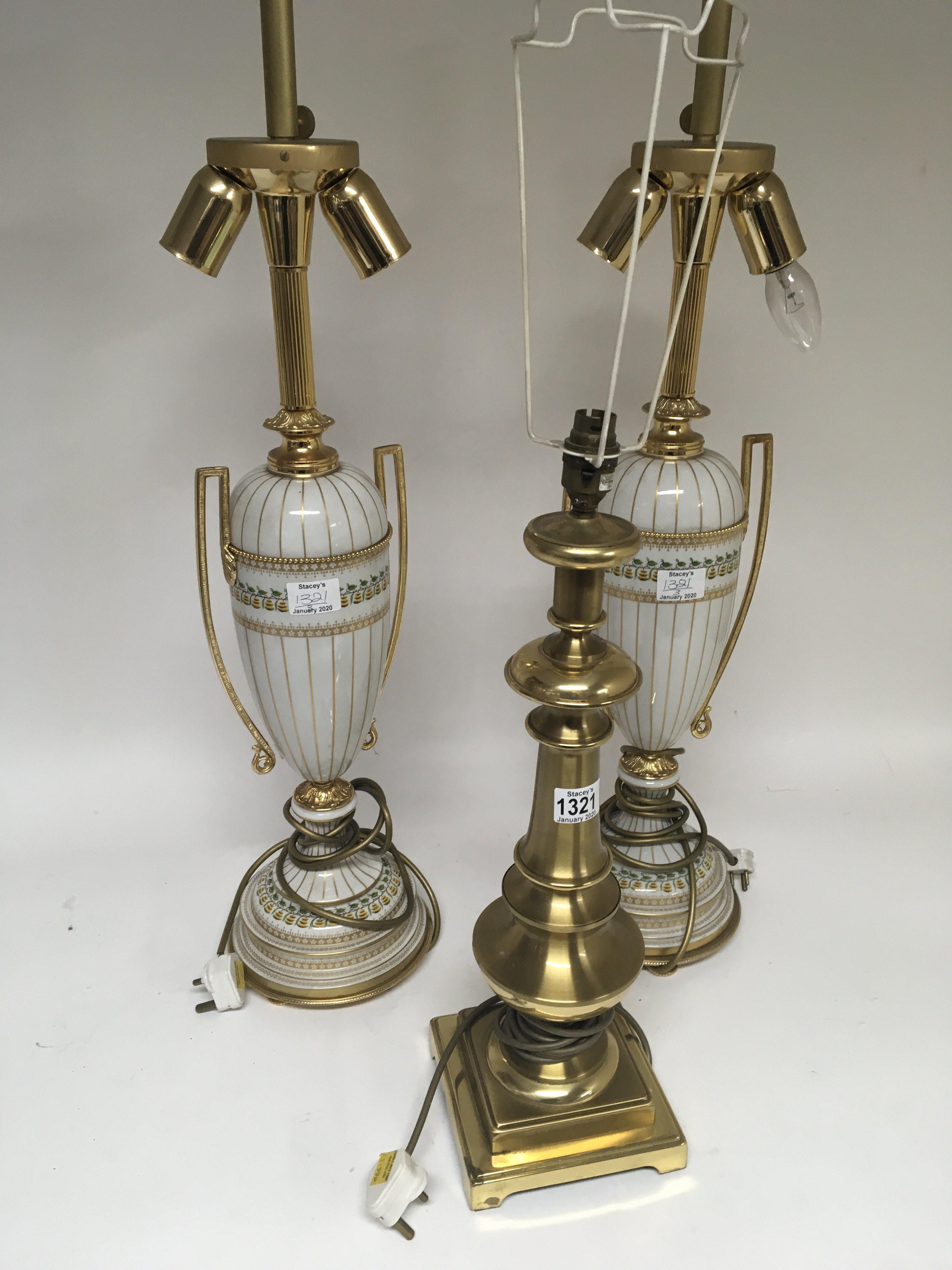 Two Quality modern porcelain and gilt metal lamps and a brass table lamp sold with shades for