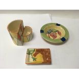 A pair of Clarice Cliff ash trays, one being Vastu