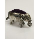 An unusual silver pin cushion shaped as an elephan