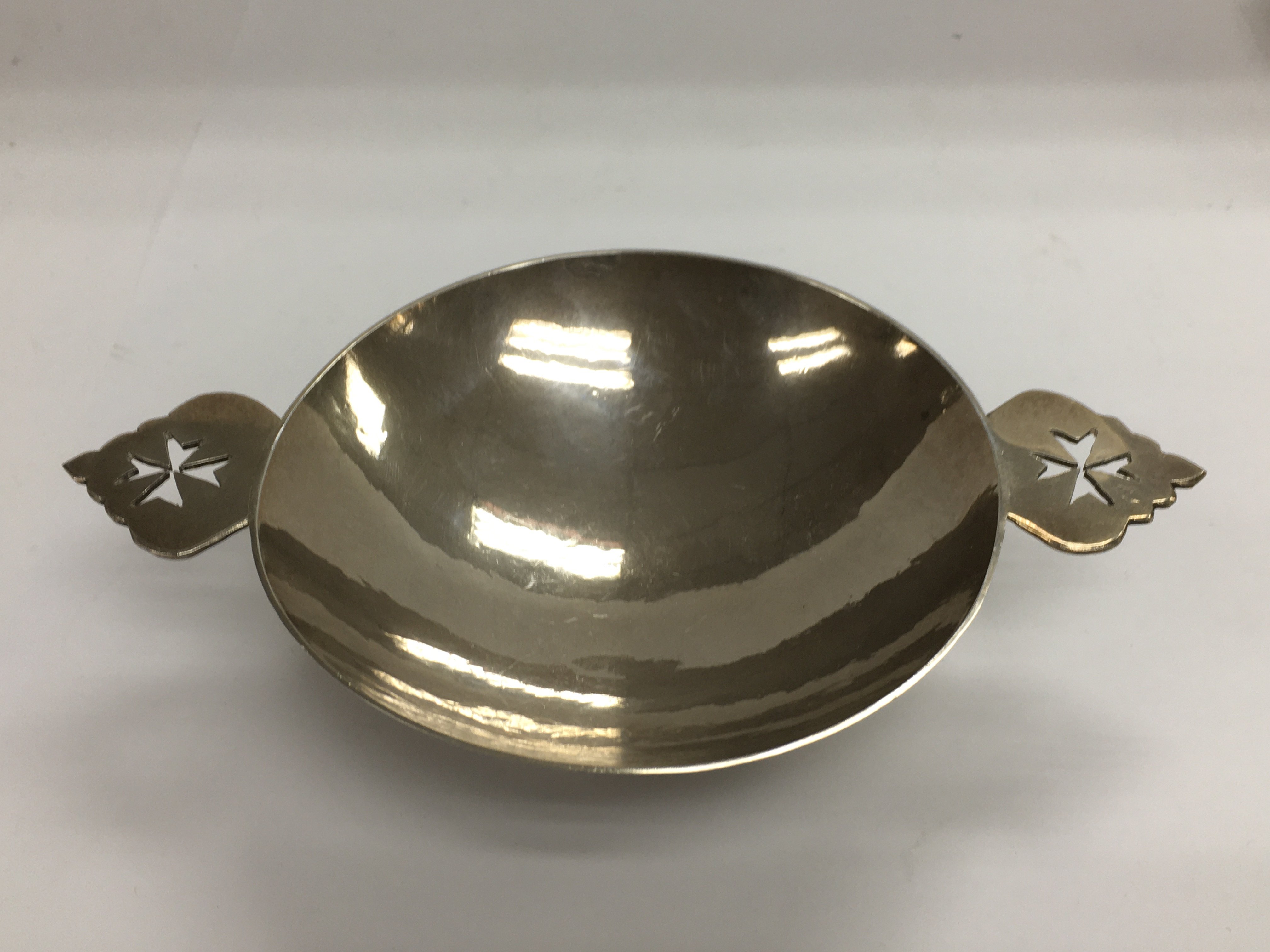 A silver bowl with handles