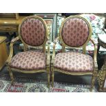 A pair of French style open armchairs with upholst