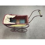 A Victorian dolls pram. Height approx 55cm.