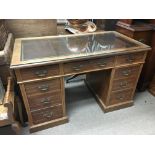 An Edwardian desk fitted with a leather top, approx 122cm x 65cm x 76cm.