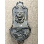 A cast metal Continental wall trough or fountain with a raised lion mask. 70cm.