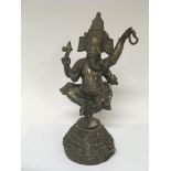 A cast brass figure of the Indian god Ganesh. Heig