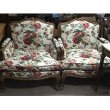 A pair of French style arm chairs with floral upho