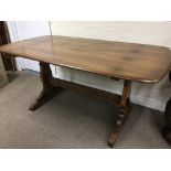 An Ercol dining table, approx 152cm x 84cm x 71.5c