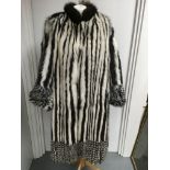 A striking, vintage full length fur coat of stripe