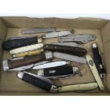 A box of assorted pen and pocket knives