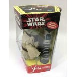 A boxed Star Wars 'Interactive Yoda' model