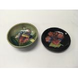 A pair of Moorcroft pin dishes, one an orchid patt