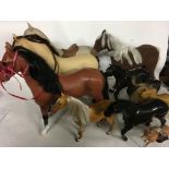 A collection of horses, Barbie and Sindy size also