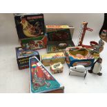 A collection of boxed tinplate reproduction clockwork/ battery operated toys including a hen that