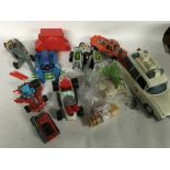 A collection of 80s toys including Ghostbusters, M