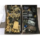 A collection of plastic military vehicles includin