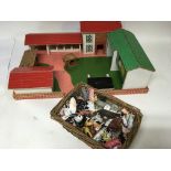 Wooden farm yard play set and a collection of plastic animals