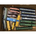 A collection of OO gauge Trains, carriages and rolling stock and also a box of trackside buildings