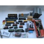 A box containing loose OO gauge railway, including