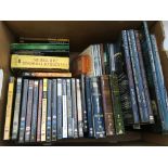 A box containing a collection of Lord of the rings, DVDs, CDs and Movie guide books etc