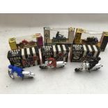 A collection of boxed Motorcycle toys including Br