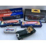 A collection of boxed Diecast vehicles including, Esso Road tanker, Chrono 1:18 scale Aston Martin