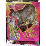 A boxed Jem Rock n Gold doll and cassette.