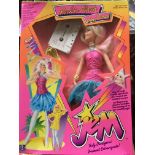 A boxed Jem Rock n Flash doll and cassette.