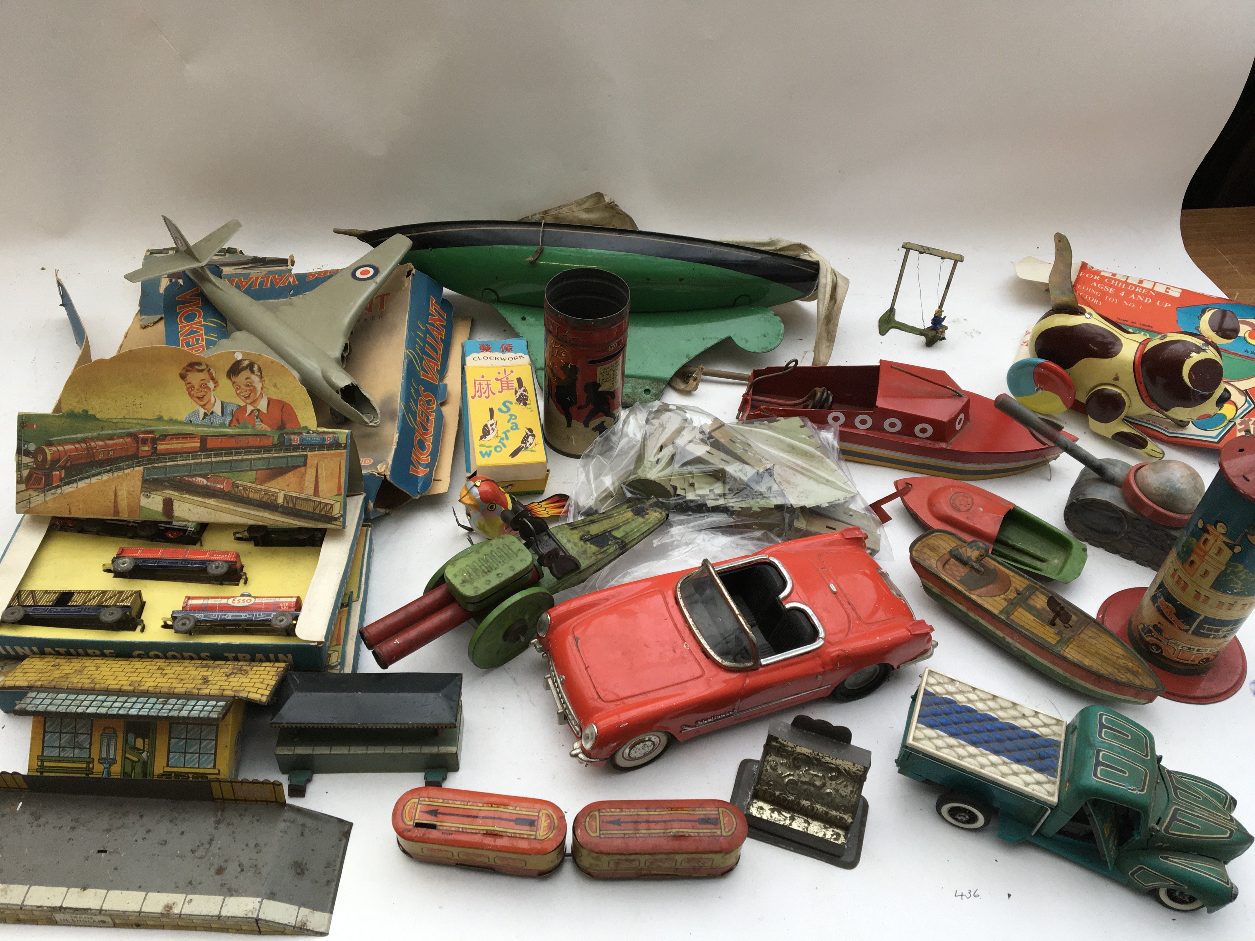 A collection of tinplate toys etc, including Boats, trains, etc