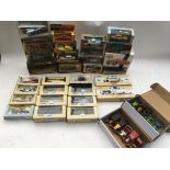 A collection of boxed diecast vehicles including,