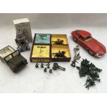 A box containing a 1:18 scale E-type jag, Britains figures on horseback boxed , a reproduction